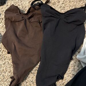 Brown and Black bodysuits SKIMS
